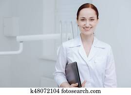 Amazing positive female person posing on camera