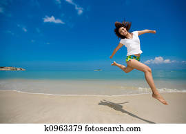 happy jump at the beach