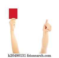 Hand of referee with red card and point the direction Hand of referee with red card and point the direction
