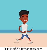 Young sporty man jogging on the beach.
