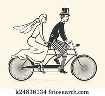Bride and groom riding a bicycle Bride and groom riding a bicycle