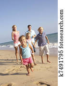Portrait Of Running Family On Beach Holiday Portrait Of Running Family On Beach Holiday