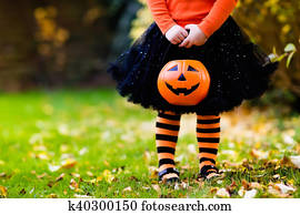 Little girl having fun on Halloween trick or treat Little girl having fun on Halloween trick or treat
