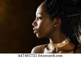 Studio profile beauty portrait of african girl. Studio profile beauty portrait of african girl.