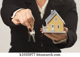 House and Keys in Female Hands