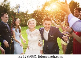 Newlyweds with guest on their garden party Newlyweds with guest on their garden party