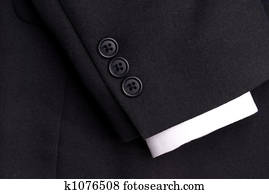 closeup of a suit sleeve with a white cuff