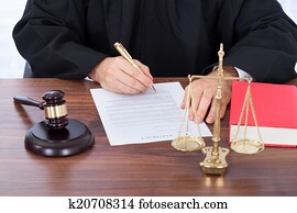 Judge Signing Contract Paper At Desk Judge Signing Contract Paper At Desk