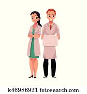 Male and female doctors in medical coats, man and woman