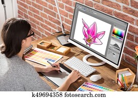 Female Graphic Designer Using Graphic Tablet Female Graphic Designer Using Graphic Tablet