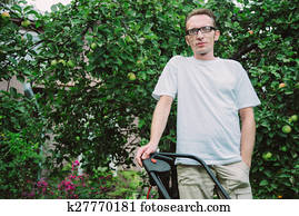 man with lawn mower