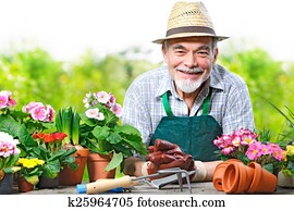 Senior man in the flower garden