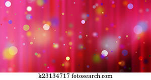 confetti against a red blurred curtain background confetti against a red blurred curtain background
