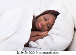 African American woman sleeping in bed African American woman sleeping in bed