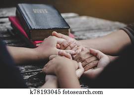 Group of different women praying together Group of different women praying together