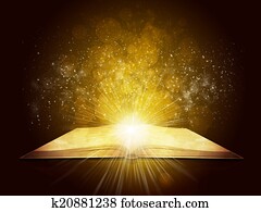 Old open book with magic light and falling stars Old open book with magic light and falling stars
