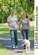 Young Couple Walking Dog Young Couple Walking Dog