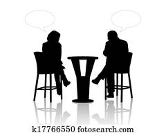 man and woman speaking at the table in a cafe