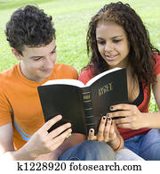 Two teens share bible Two teens share bible