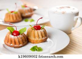 fancy cakes dessert with cappuccino coffee on table fancy cakes dessert with cappuccino coffee on table