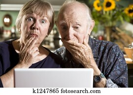 perplexed Senior Couple with a Laptop Computer perplexed Senior Couple with a Laptop Computer