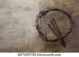 Jesus Crown Thorns and nails on Old and Grunge Wood Background. Vintage Retro Style. Free space for text