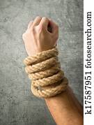 Male hands tied with a rope