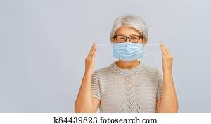Senior woman wearing facemask Senior woman wearing facemask