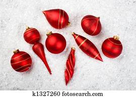 An image of christmas ornaments in snow An image of christmas ornaments in snow