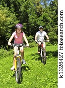 Family riding bicycles Family riding bicycles