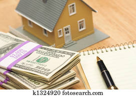 House and Money with Pad and Pen