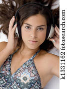 high angle view of high angle view of laying woman with headphone on an isolated background