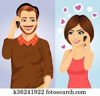 Young couple using smartphone wireless communications Young couple using smartphone wireless communications