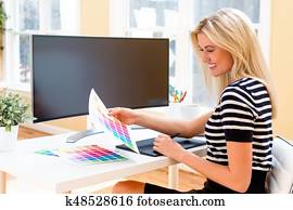 Graphic designer using her pen tablet device Graphic designer using her pen tablet device