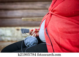 Pregnant woman knitting