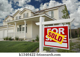Sold Home For Sale Sign and House Sold Home For Sale Sign and House