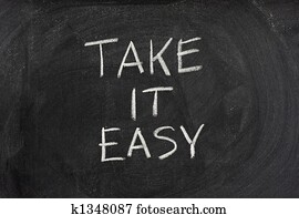 Take it easy phrase on blackboard Take it easy phrase on blackboard
