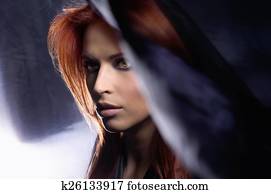 Young attractive woman in blowing silk