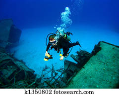 Diver photographing a Sunken Shipwreck