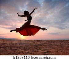 Jumping woman at sunset Jumping woman at sunset