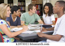 College students studying together in a library College students studying together in a library