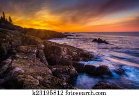 Sunrise over rocky coast and the Atlantic Ocean at Acadia Nation