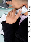 back pose of lawyer talking on phone