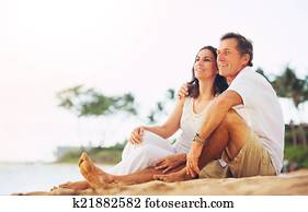 Mature Couple Enjoying Sunset on the Beach