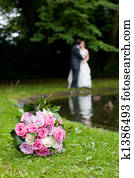 Bride & Groom behind a bouquet Bride & Groom behind a bouquet