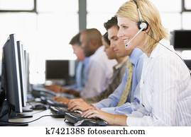 Stock Traders With Headsets At Work