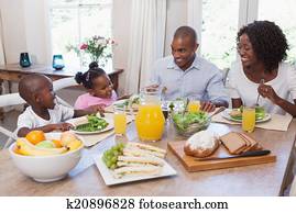 Happy family having lunch together