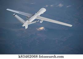 unmanned RC military drone flies over mountains at sunrise. Elements of this image furnished by NASA unmanned RC military drone flies over mountains at sunrise. Elements of this image furnished by NASA