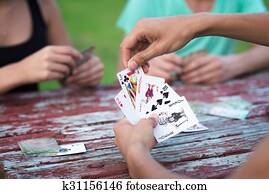 Group of people playing cards