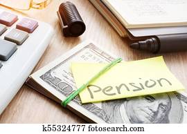 Memo with word pension on a stack of money. Retirement plan.